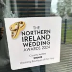 Northern Ireland Wedding Awards 2024 - County Antrim Winner, Wedding Boutique of the Year award plaque displayed on a window